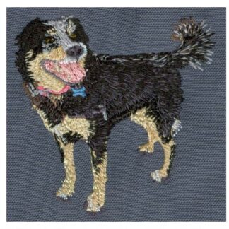 Custom embroidered hoop art of a black dog