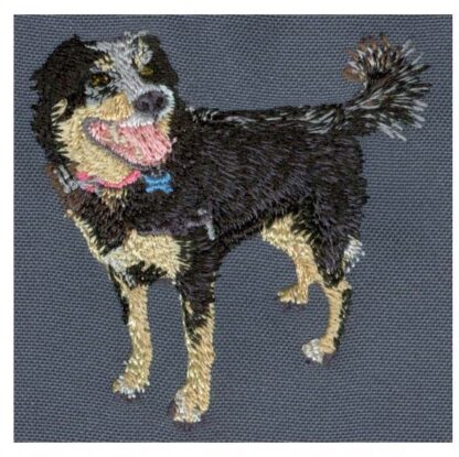 Custom embroidered hoop art of a black dog